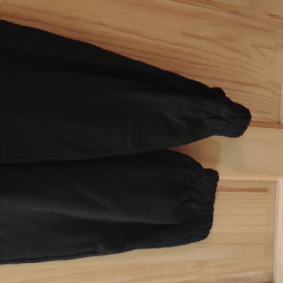 Black soft jumpsuit with back and side pockets; elastic leg bottoms - Picture 7 of 10